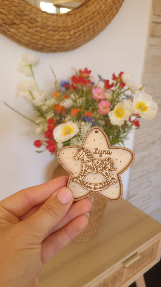 Petite étoile de Noël cheval à bascule